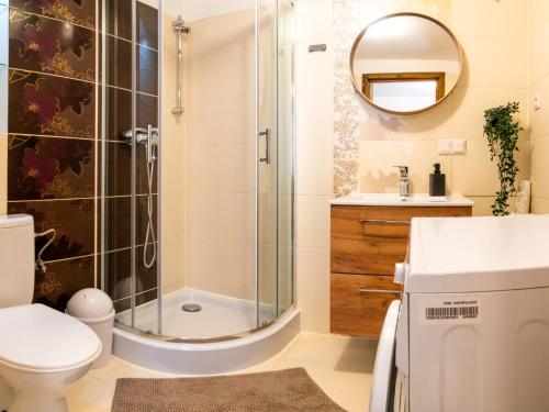 Kúpeľňa v ubytovaní Apartamenty Zakątek Harenda