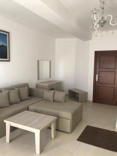 a living room with a couch and a coffee table at Imperial Hotel in Ulcinj