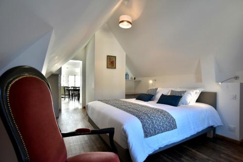 Tempat tidur dalam kamar di LOstra 2 - Appartement avec mezzanine