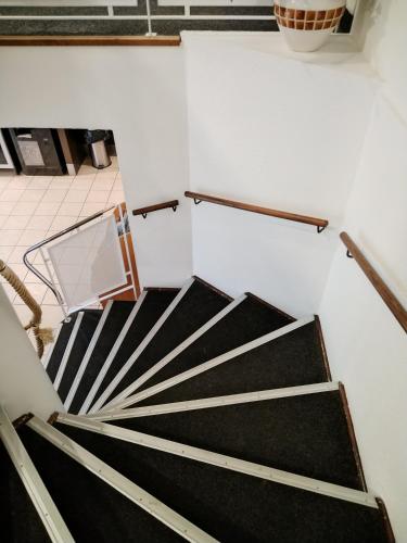 a view of a staircase in a room at Hotel Inn Design Montluçon in Montluçon