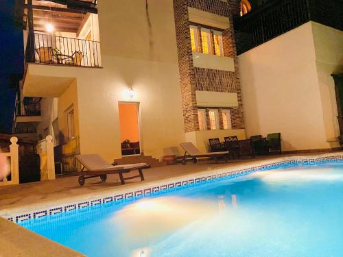 a large swimming pool in the middle of a building at Mirador Del Olivar in Gójar