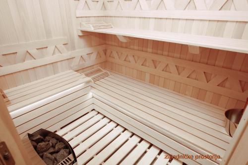 an empty sauna with a bench in a room at Montelux Apartments in Budva