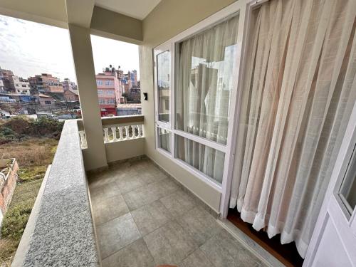 a balcony with a view of a city at Shakya House in Pātan