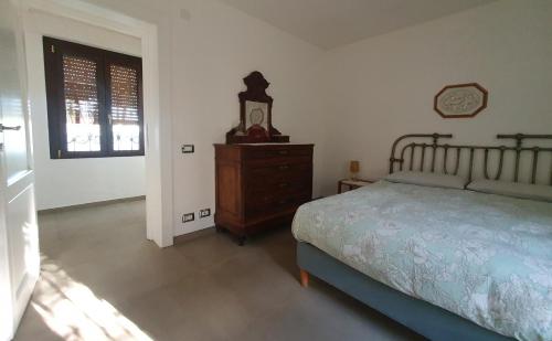 Postel nebo postele na pokoji v ubytování Asinara