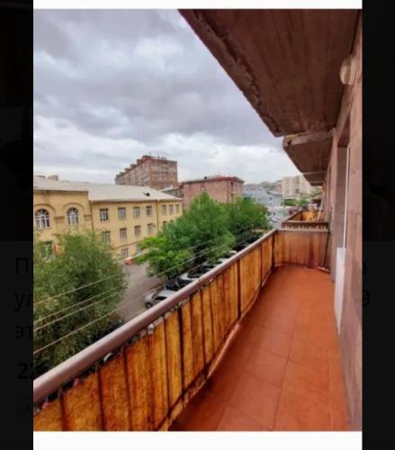 a balcony with a view of a city at Квартира в центре Еревана in Yerevan