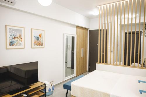 TV a/nebo společenská místnost v ubytování Alfa-Central Luxury Condo by Optimum Link