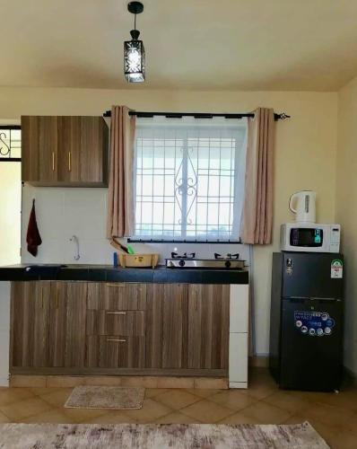 Kuchyň nebo kuchyňský kout v ubytování The Faridooh's Comfy Homes Mtwapa
