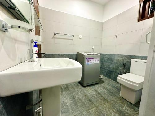 a bathroom with a sink and a toilet at Serene Bliss Villa in Unawatuna