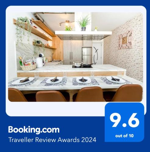 a screenshot of a kitchen with a table and chairs at The White Apartment 3BR - free parking in Sofia