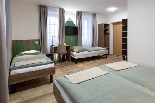 Postel nebo postele na pokoji v ubytování Penzion Aurelia Donovaly