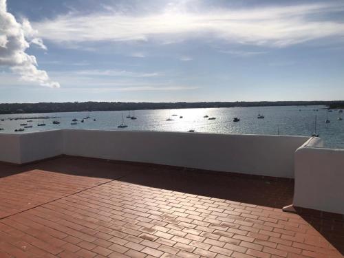 a view of a body of water with boats in it at Apartamentos Sabina Playa in La Savina