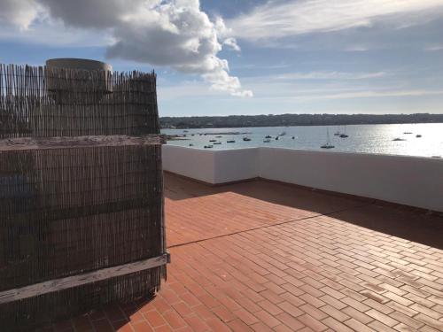 a view of a body of water with boats in it at Apartamentos Sabina Playa in La Savina