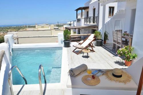 a balcony with a swimming pool on a building at Villa Areti Naxos in Glinado Naxos