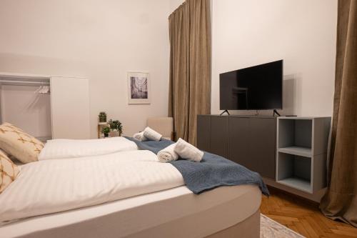 Säng eller sängar i ett rum på Top 2-room apartment in a 1st district of Vienna