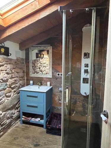 a bathroom with a blue sink and a shower at Casa Rural Garzibaita in Sumbilla