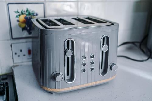 a toaster sitting on top of a kitchen counter at Large 7 bedroom town house in Chester City Centre in Chester