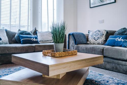 a living room with a coffee table and a couch at Large 7 bedroom town house in Chester City Centre in Chester