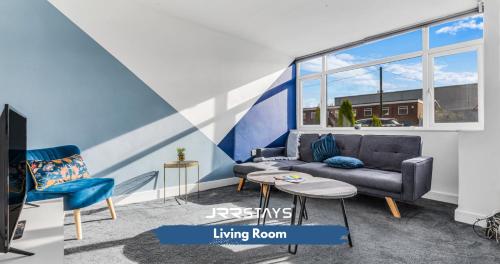 a living room with a couch and a table at Tipton 3 Bedroom House Garden Sleeps 7 - JRR Stays in Coseley