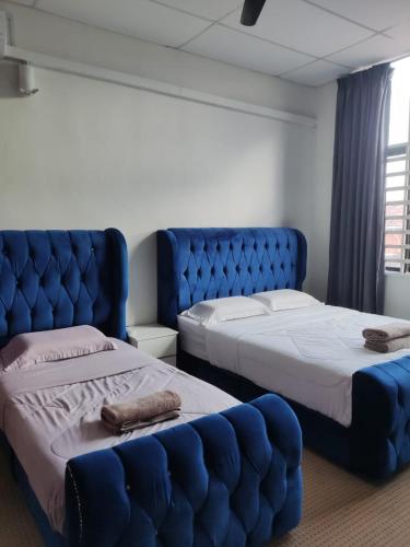 Postel nebo postele na pokoji v ubytování Mann Maju Inn & Hotel Kuala Berang
