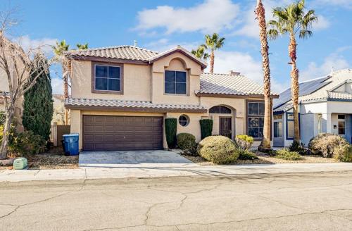 a house with palm trees and a garage at Chic Vegas Retreat: Near Top Attractions in Las Vegas