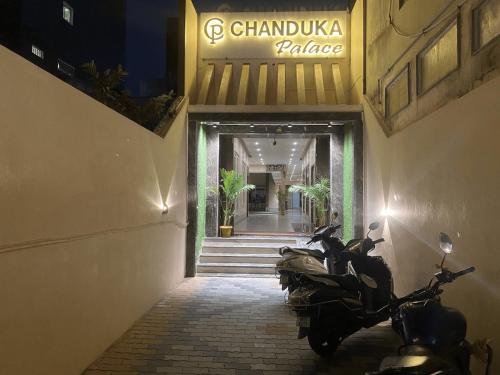 a group of motorcycles parked outside of a building at Hotel Chanduka Palace , Puri in Puri