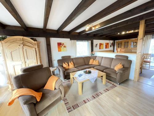 a living room with two couches and a table at Holiday Home Ferienpark Vorauf-3 by Interhome in Molberting