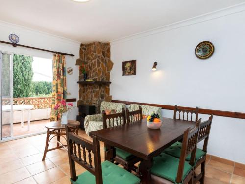 a dining room with a table and chairs at Apartment Adelfa apt 6 by Interhome in Sant Martí d'Empúries