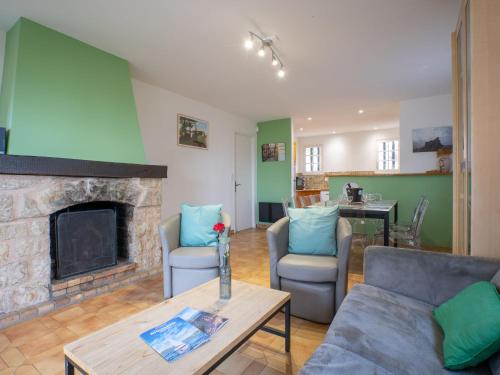 a living room with a couch and a fireplace at Villa La Galandière by Interhome in Saint-Aygulf