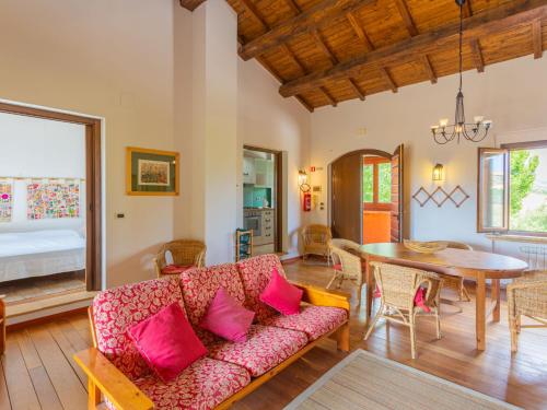 a living room with a couch and a table at Apartment I Due Carpini-2 by Interhome in Citta' Sant'Angelo