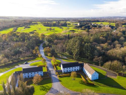 an aerial view of a house and golf course at Holiday Home Castlemartyr Holiday Lodge by Interhome in Cork