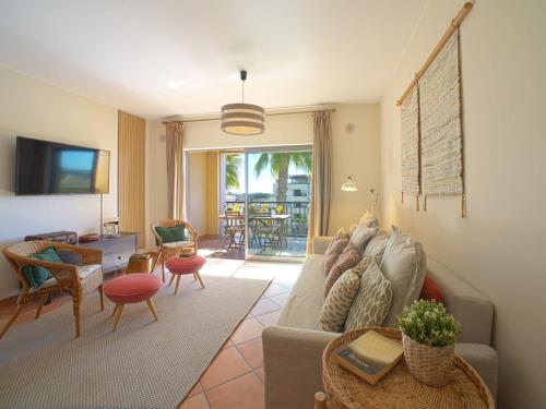 a living room with a couch and a table at Apartment Vilas Mouriscas by Interhome in Vilamoura