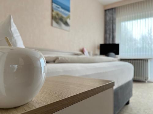 En eller flere senge i et værelse på Hotel zum Rosenteich