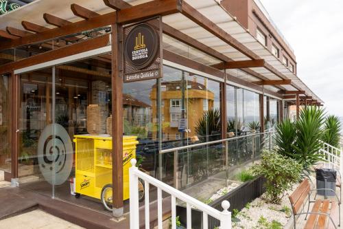 a building with a yellow object inside of it at Hotel Crisol de las Rías in Miño