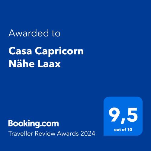a screenshot of a cell phone with the text awarded to casa capricorn at Casa Capricorn Nähe Laax in Sagogn