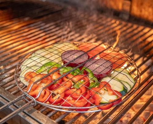 a basket of food sitting on a grill at Hotel Crisol de las Rías in Miño
