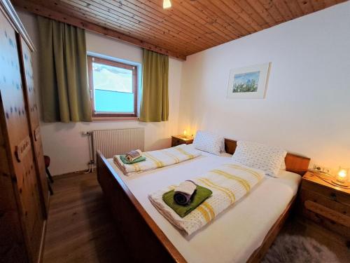 a bedroom with two beds and a window at Apartment Jaggler by Interhome in Dorf