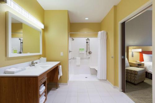 a bathroom with a sink and a shower at Home2 Suites by Hilton Fort Smith in Fort Smith
