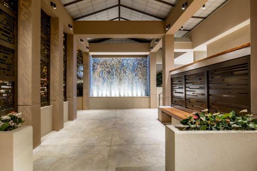 a hallway with a large window in a building at Hilton Garden Inn Waikiki Beach in Honolulu