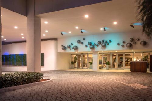 a lobby of a building with a lot of pots at DoubleTree Resort Hollywood Beach in Hollywood