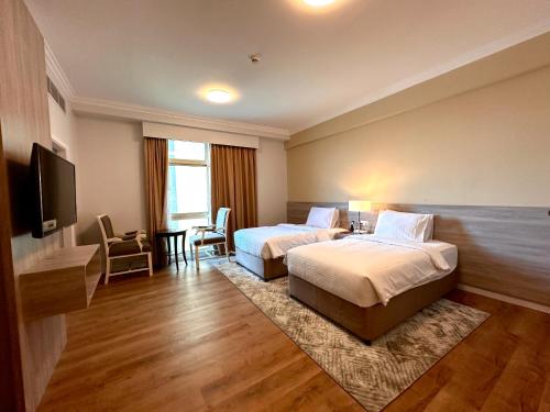 Ένα ή περισσότερα κρεβάτια σε δωμάτιο στο MIRADOR HOTEL