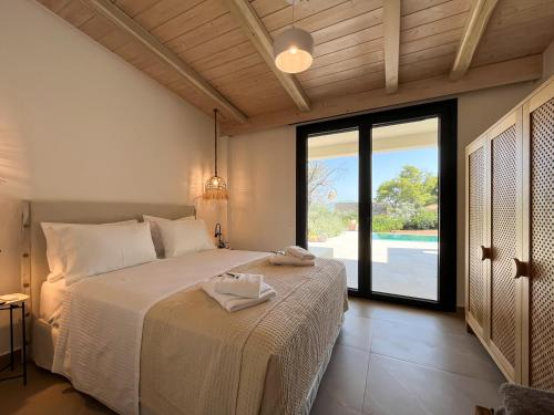 Кровать или кровати в номере Villa Althea in Porto Heli