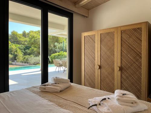 Кровать или кровати в номере Villa Althea in Porto Heli