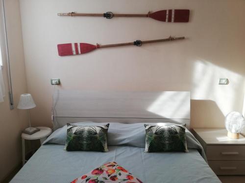 Una cama o camas en una habitación de Lido I Palmizi