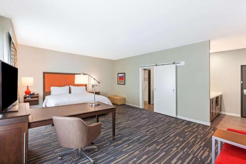 a hotel room with a bed and a desk at Hampton Inn & Suites Houston/Atascocita, Tx in Humble