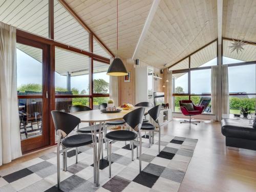 a dining room with a table and chairs at Holiday Home Juliana - 400m from the sea by Interhome in Nordborg