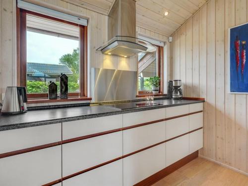 a kitchen with a sink and a window at Holiday Home Juliana - 400m from the sea by Interhome in Nordborg