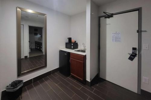 a bathroom with a sink and a mirror at Comfort Inn Somerset - Lake Cumberland in Somerset