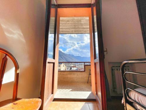 an open door to a balcony with a view at Terrazza Rinaldi - centro - wifi - Panoramico in Fanano