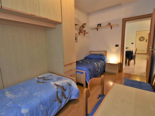 Ένα ή περισσότερα κρεβάτια σε δωμάτιο στο Apartment Casa Le Fontane by Interhome