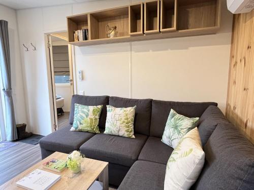 a living room with a couch and a table at Holiday Home Paul by Interhome in Wemding